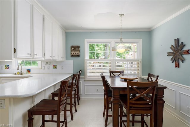 3600 Spicebush Trl, Greensboro, NC 27410 - dining area featuring a decorative wall, a wainscoted wall, and ornamental molding