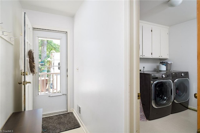 3600 Spicebush Trl, Greensboro, NC 27410 - laundry room with washing machine and clothes dryer and cabinet space