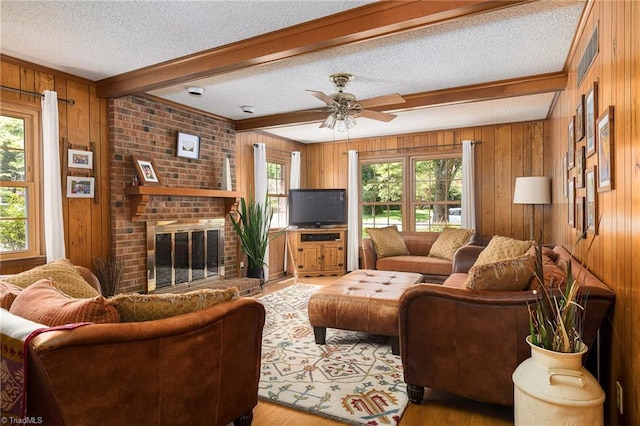 3600 Spicebush Trl, Greensboro, NC 27410 - living area with healthy amount of natural light, light wood-type flooring, a textured ceiling, wood walls, and beamed ceiling