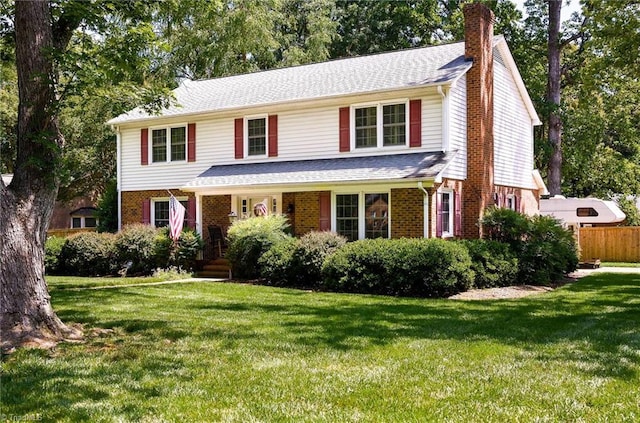 3600 Spicebush Trl, Greensboro, NC 27410 - view of front facade featuring a chimney, brick siding, and a shingled roof