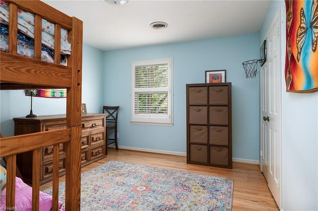 3600 Spicebush Trl, Greensboro, NC 27410 - bedroom with light wood-style flooring and baseboards