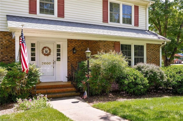 3600 Spicebush Trl, Greensboro, NC 27410 - doorway to property with brick siding and a shingled roof