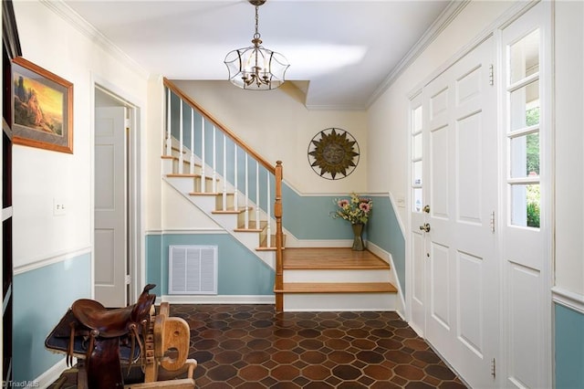 3600 Spicebush Trl, Greensboro, NC 27410 - entrance foyer with stairs, a chandelier, and ornamental molding