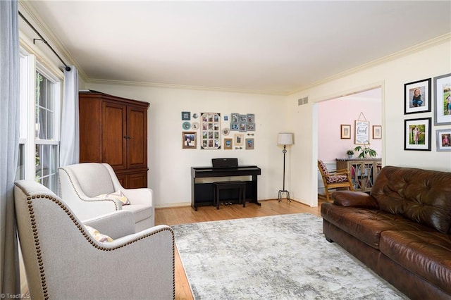 3600 Spicebush Trl, Greensboro, NC 27410 - living area featuring light wood finished floors and crown molding
