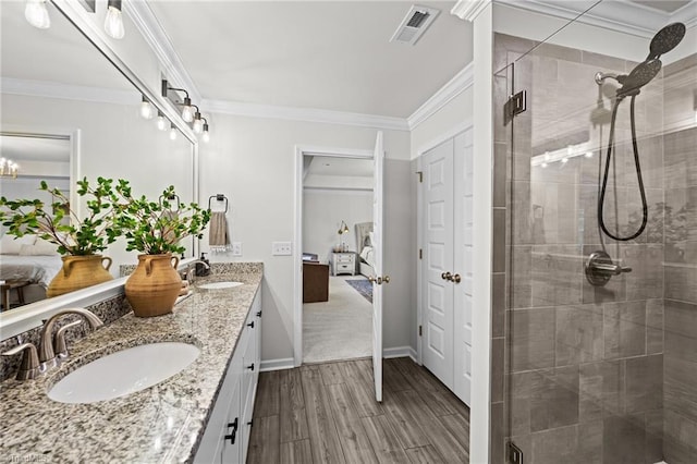 ensuite bathroom featuring visible vents, a sink, ensuite bath, and a stall shower
