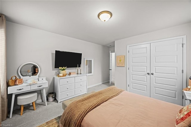 carpeted bedroom featuring a closet