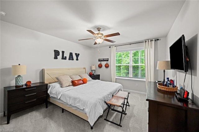 carpeted bedroom with baseboards and ceiling fan