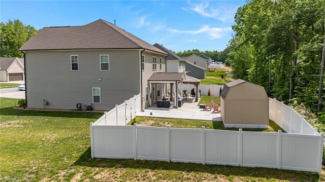 rear view of house with a yard, a gazebo, a fenced backyard, and a patio area