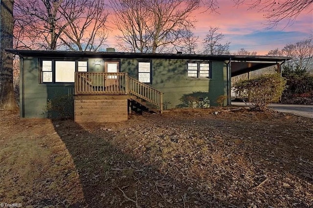 view of front facade with a carport