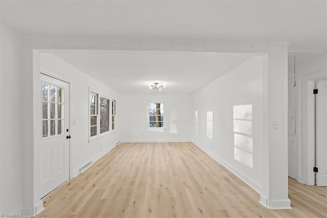 empty room with light wood-type flooring