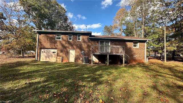 rear view of house featuring cooling unit, a wooden deck, a garage, and a lawn