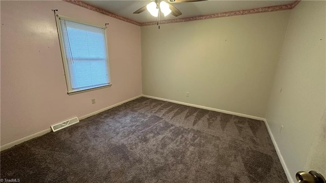 empty room featuring carpet flooring and ceiling fan