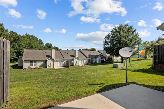 view of yard with a patio area and a residential view