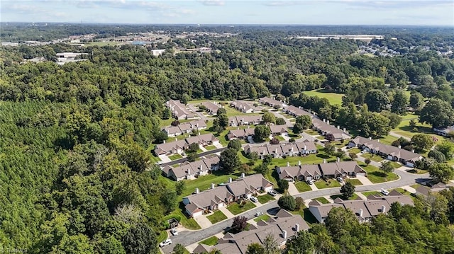 aerial view with a forest view and a residential view