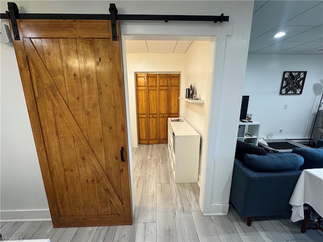 1346 Overland Trl, Hays, NC 28635 - hall featuring a barn door, light wood-style floors, recessed lighting, and baseboards