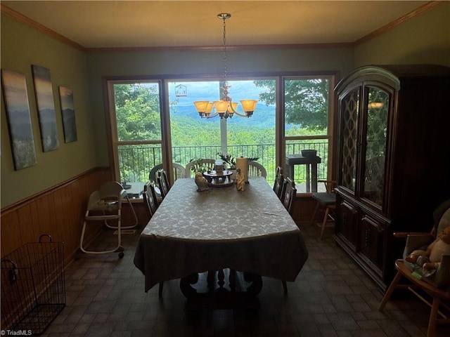 1346 Overland Trl, Hays, NC 28635 - dining area with wainscoting, plenty of natural light, a chandelier, wood walls, and brick patterned floors