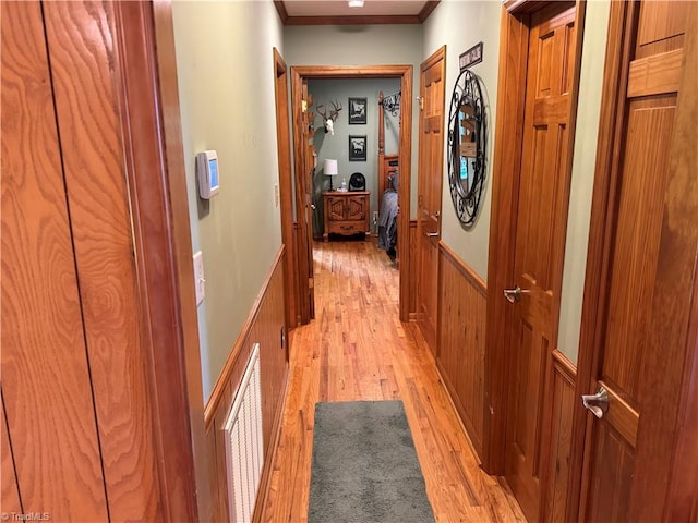 1346 Overland Trl, Hays, NC 28635 - hall featuring light wood-style flooring, crown molding, a wainscoted wall, and wooden walls