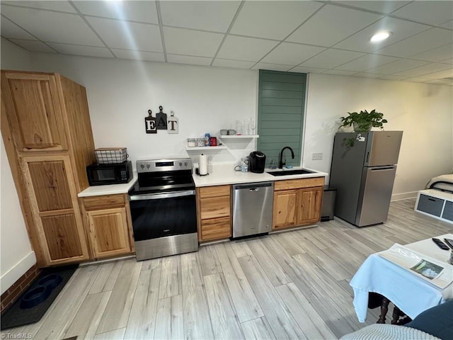 1346 Overland Trl, Hays, NC 28635 - kitchen with stainless steel appliances, a sink, light wood finished floors, light countertops, and a paneled ceiling