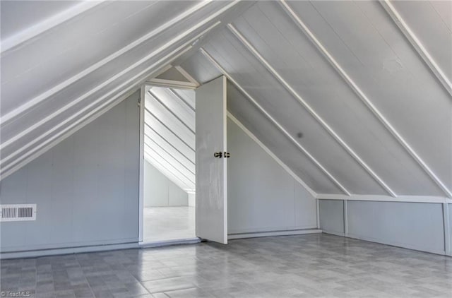 bonus room featuring visible vents and vaulted ceiling