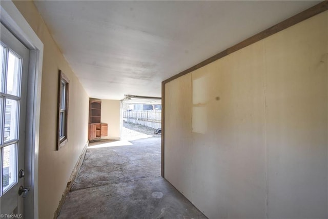 corridor with concrete flooring