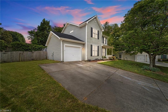 900 Biloxi Ave, Kernersville, NC 27284 - view of front of house with a front lawn, an attached garage, fence, and concrete driveway