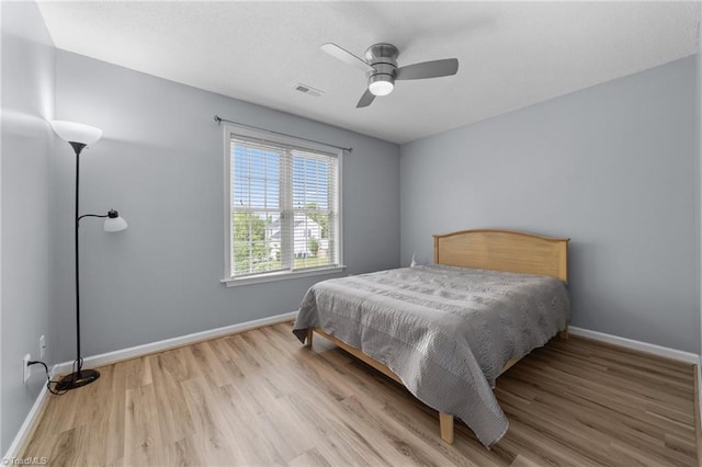 900 Biloxi Ave, Kernersville, NC 27284 - bedroom with baseboards, ceiling fan, light wood finished floors, and visible vents