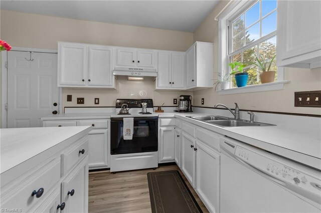 900 Biloxi Ave, Kernersville, NC 27284 - kitchen featuring a sink, dishwasher, light countertops, white cabinets, and range with electric cooktop