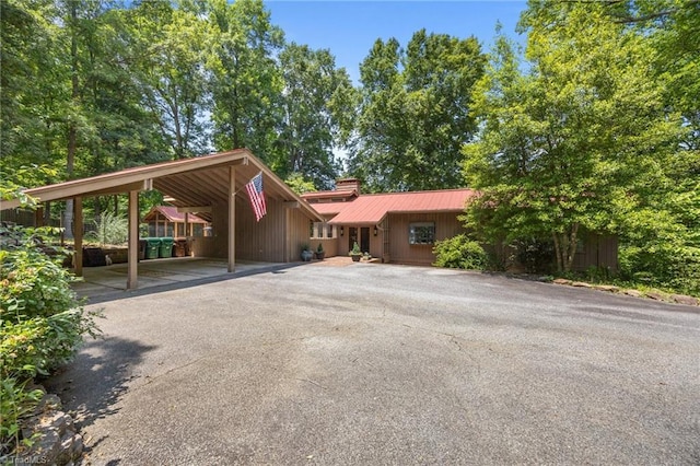 3715 Bentbrook Dr, High Point, NC 27265 - view of front facade featuring a chimney and a metal roof