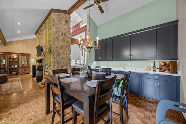 3715 Bentbrook Dr, High Point, NC 27265 - dining space featuring high vaulted ceiling, ceiling fan, a chandelier, beam ceiling, and a fireplace