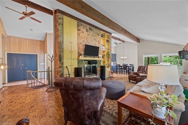 3715 Bentbrook Dr, High Point, NC 27265 - living area with ceiling fan, wooden walls, a fireplace, a chandelier, and a textured ceiling