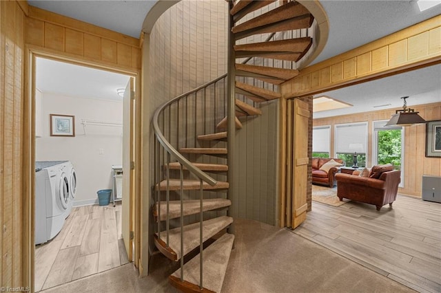 3715 Bentbrook Dr, High Point, NC 27265 - stairway with washer and clothes dryer, wood finished floors, and wood walls