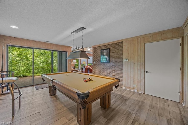 3715 Bentbrook Dr, High Point, NC 27265 - game room featuring wood walls, light wood-style flooring, a textured ceiling, and billiards table