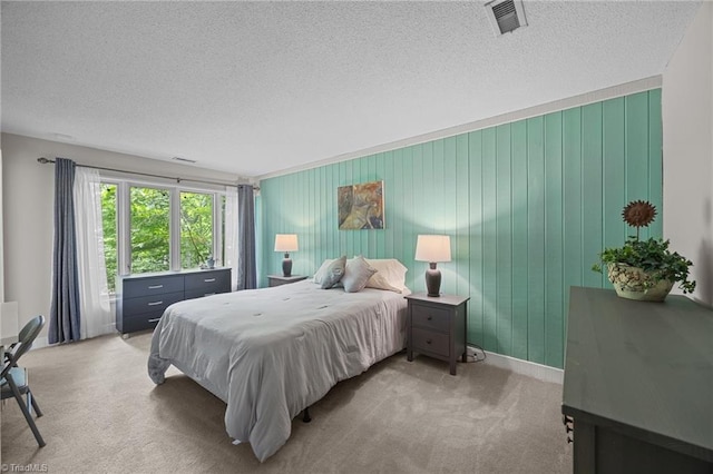 3715 Bentbrook Dr, High Point, NC 27265 - carpeted bedroom featuring a textured ceiling and baseboards