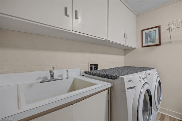 3715 Bentbrook Dr, High Point, NC 27265 - laundry room with cabinet space, washing machine and dryer, and wood finished floors