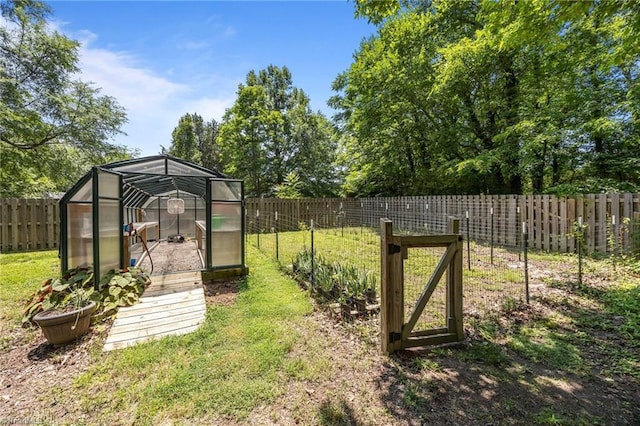 3715 Bentbrook Dr, High Point, NC 27265 - fenced backyard featuring a greenhouse and an outdoor structure