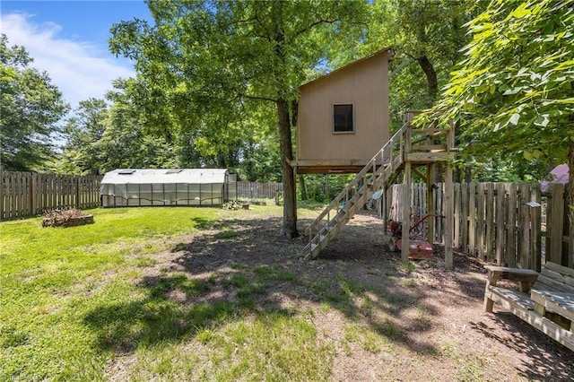 3715 Bentbrook Dr, High Point, NC 27265 - fenced backyard featuring an exterior structure, an outdoor structure, and stairs