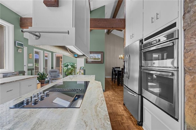 3715 Bentbrook Dr, High Point, NC 27265 - kitchen featuring appliances with stainless steel finishes, white cabinets, high vaulted ceiling, beamed ceiling, and light stone counters