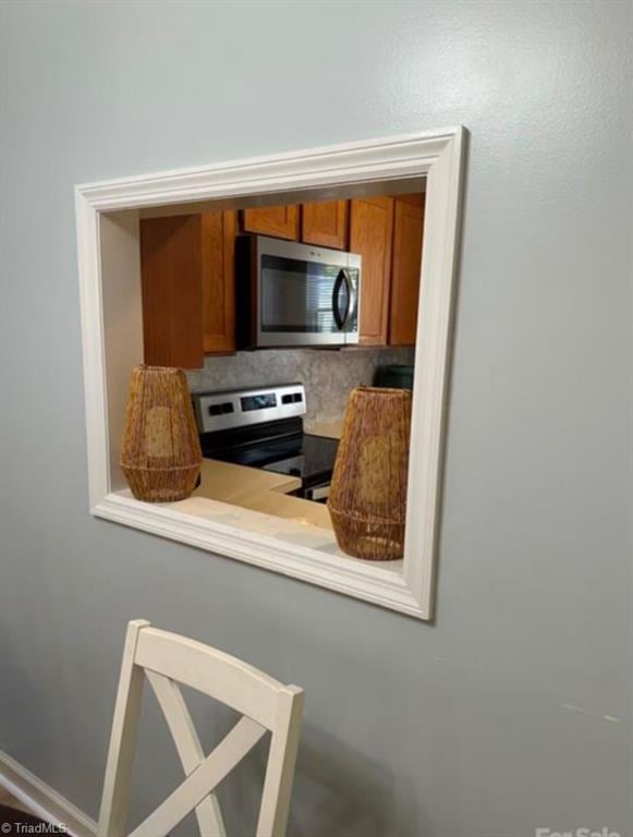 kitchen featuring stainless steel appliances and backsplash