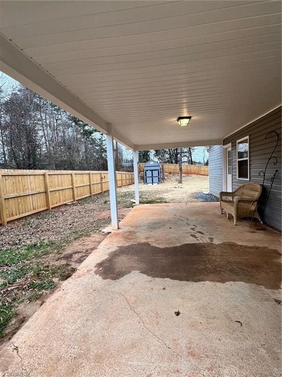 view of patio featuring a storage shed