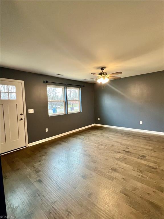 interior space featuring ceiling fan and hardwood / wood-style floors