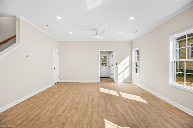 unfurnished living room featuring crown molding, recessed lighting, light wood-style flooring, baseboards, and stairs