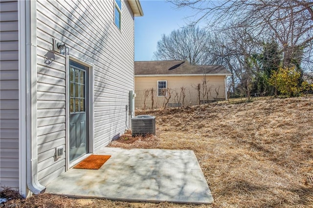 view of yard with cooling unit and a patio area