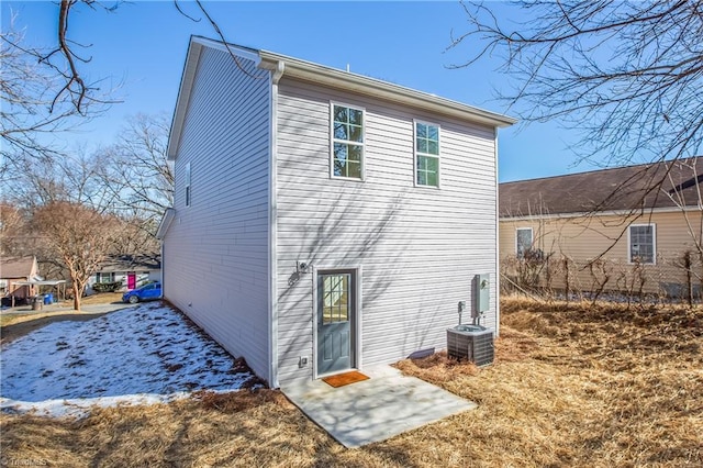 back of property featuring central AC unit