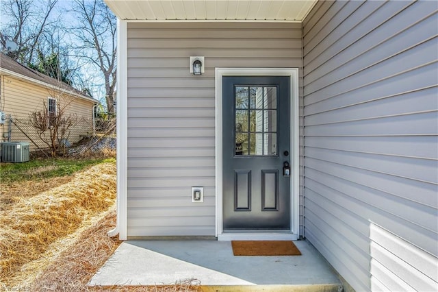 doorway to property with central AC unit