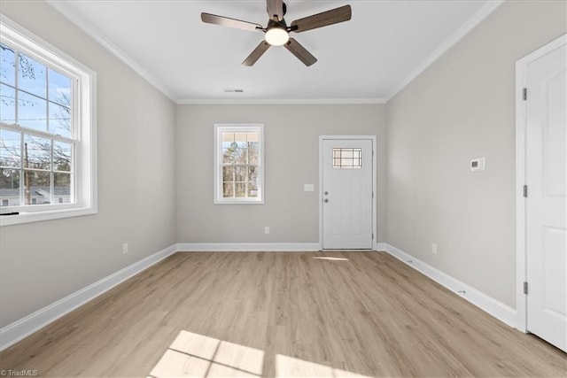 unfurnished room with crown molding, ceiling fan, and light wood-type flooring