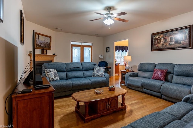 4036 Eastside Ct, Winston-Salem, NC 27127 - living room with ceiling fan, wood finished floors, and a fireplace