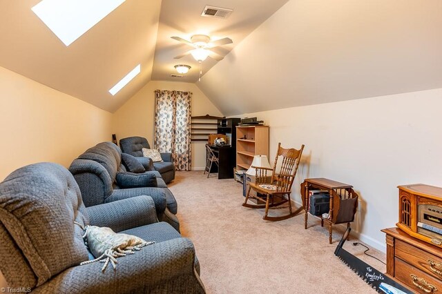 4036 Eastside Ct, Winston-Salem, NC 27127 - living room with light carpet, a skylight, vaulted ceiling, a ceiling fan, and baseboards