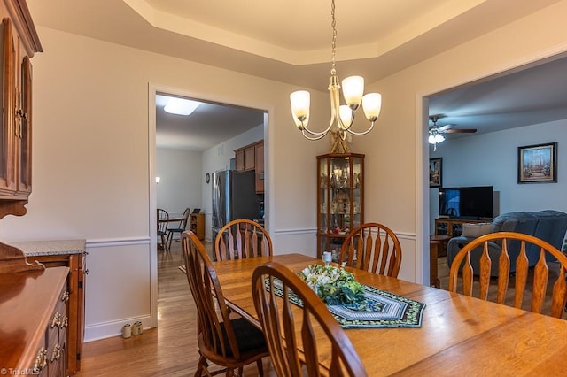 4036 Eastside Ct, Winston-Salem, NC 27127 - dining space with dark wood finished floors, ceiling fan, and a raised ceiling