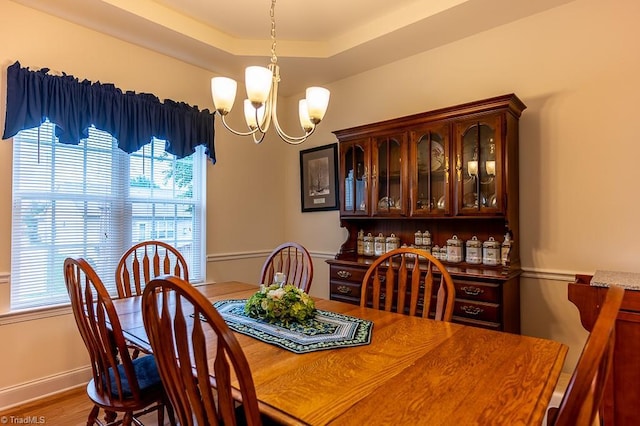 4036 Eastside Ct, Winston-Salem, NC 27127 - dining room featuring a chandelier, wood finished floors, and baseboards