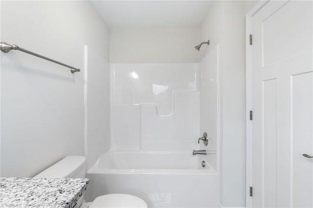 bathroom with vanity, toilet, and shower / bathtub combination